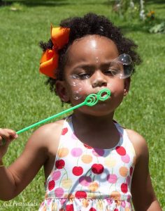 girl_blowing_soap_bubbles