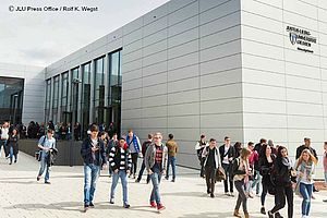 Students walk outside of the law school at Justus Liebig University in Giessen, Germany.