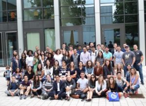 Approximately 60 law students pose for a group photo in front of the law school building at Justus Liebig University in Giessen, Germany.c