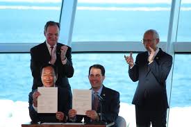 Foxconn executives and Governor Walker sign agreement at Milwaukee Art Museum