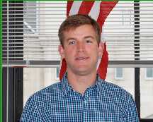 Headshot of attorney Daniel Murphy standing in front of a window.