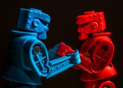 Red and blue Rock'em-Sock'em Robots facing off