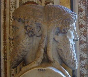 Photo of statue depicting a bust of Janus, the two-headed Roman God.