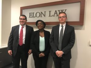 Moot Court students in front of Elon Law sign