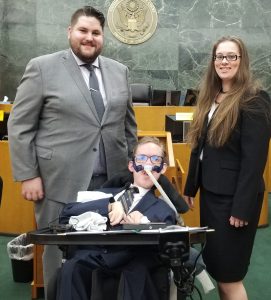 3 law students posing in courthouse professional dress