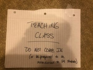 handwritten sign that says Teaching Class do not come in.
