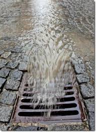 Stormwater flowing into a grate