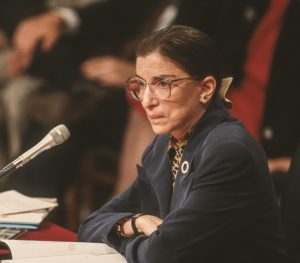 Ruth Bader Ginsburg sitting at a table during her confirmation hearings in 1993