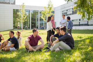 image of students sitting outside