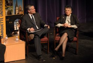 Mike Gousha sits in a chair, listening to Shirley Abrahamson talk, May 2008