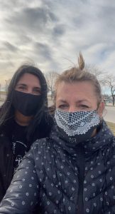 close up of two women with masks