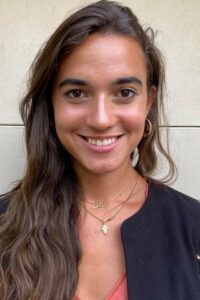 head shot of a young woman with long dark brown hair; her name is Noelle-Nadia Filali