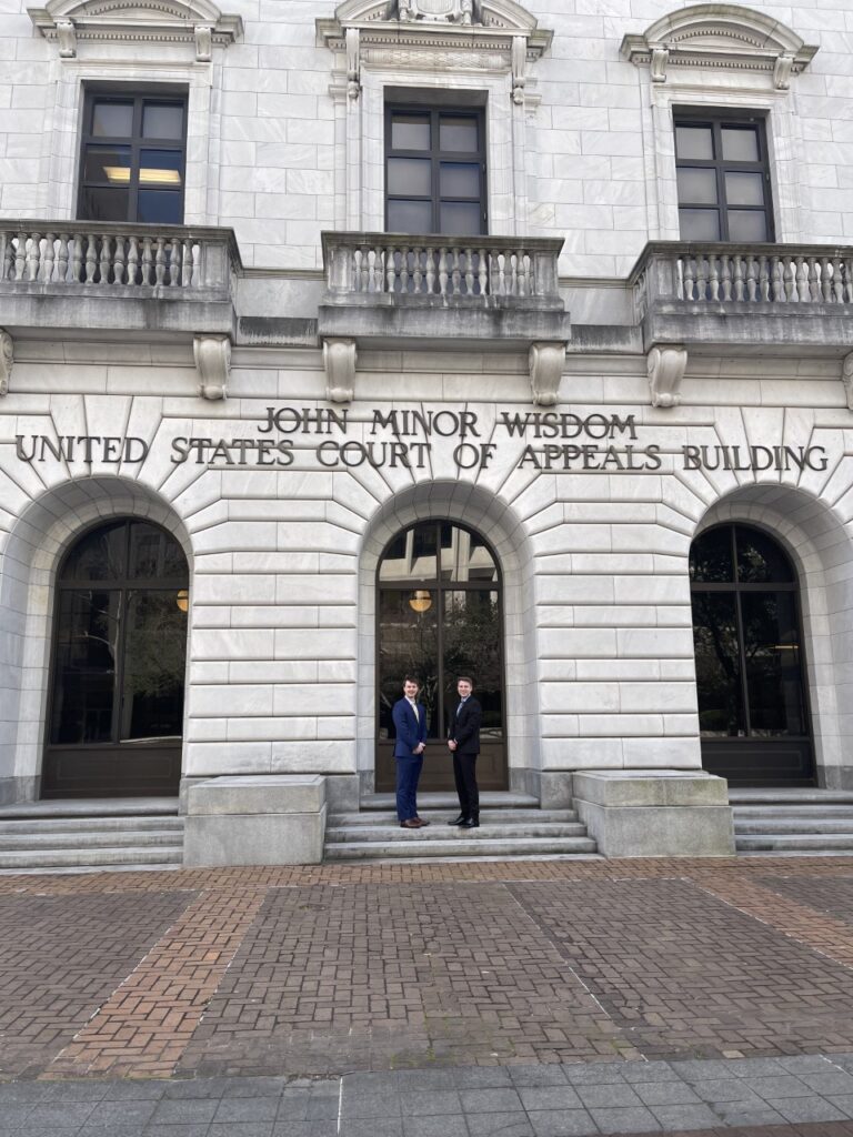 Sports Law moot court team members in front of the John Minor Wisdom Federal Courthouse in New Orleans