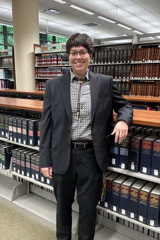 Franky standing in the library