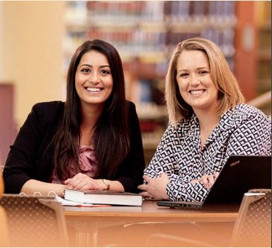 Two students at a table