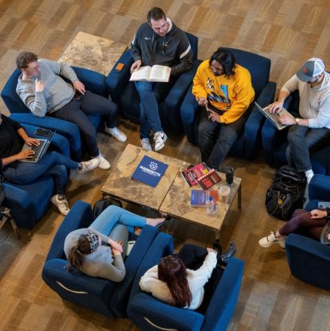 Students sitting in a circle talking